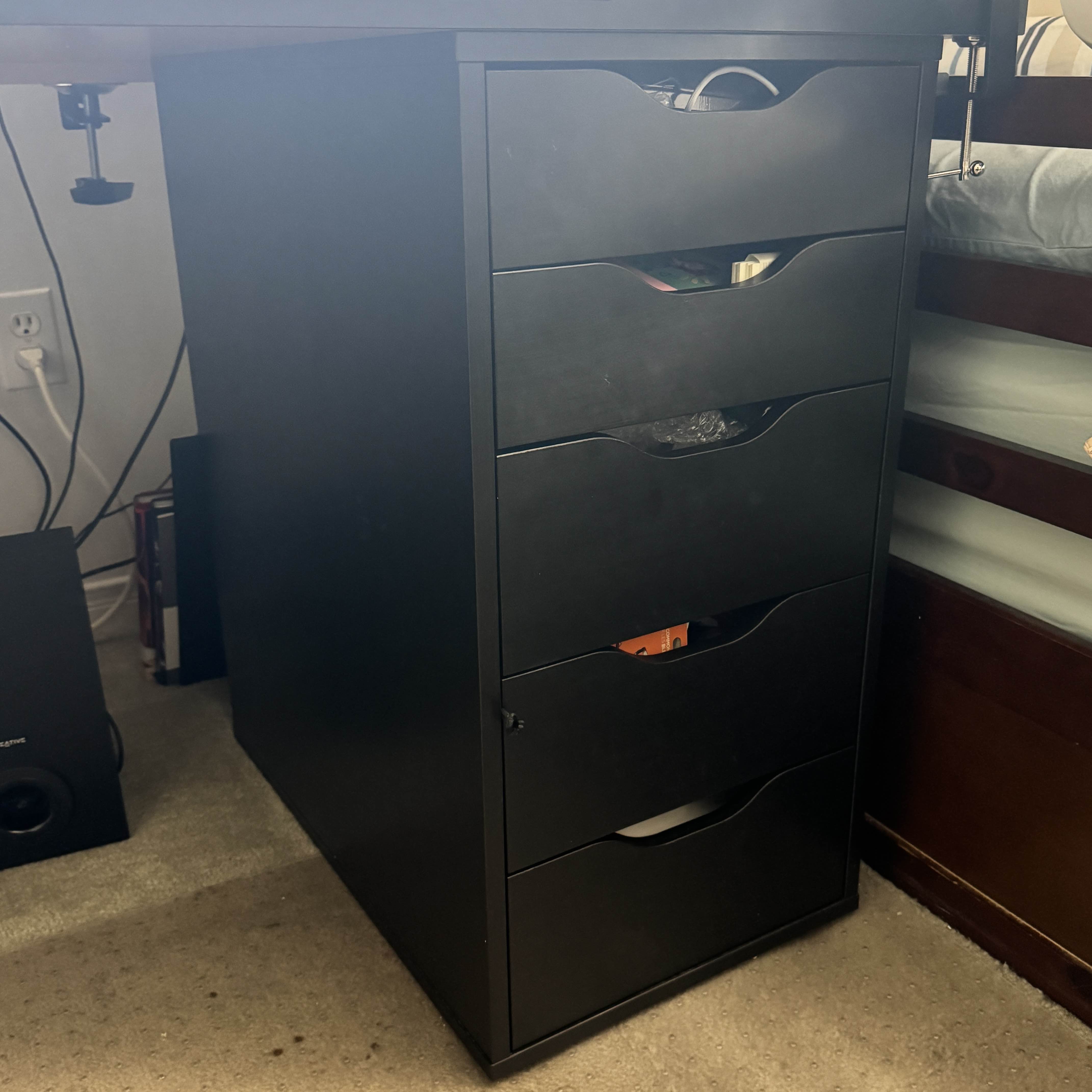 With all these drawers holding my desk, I put a lot of things in them that I need on a frequent basis. For example, my Xbox controller, my phone stand, scissors, notebooks, etc.